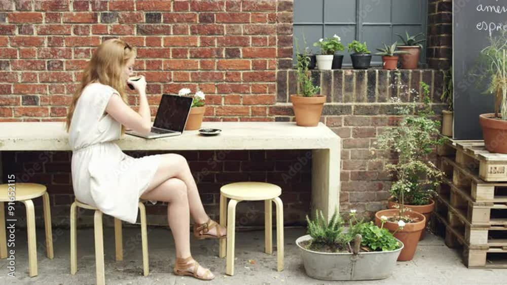 Beautiful woman drinking coffee working in cafe Beautiful woman drinking coffee working in cafe