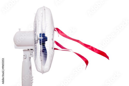 Working air fan with red ribbons isolated on white. Air movement