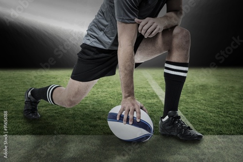 Composite image of rugby player in black jersey 
