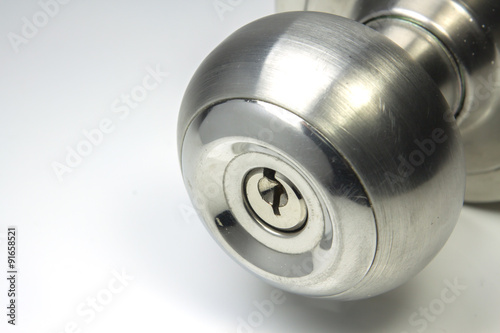 close up metal doorknob on white background