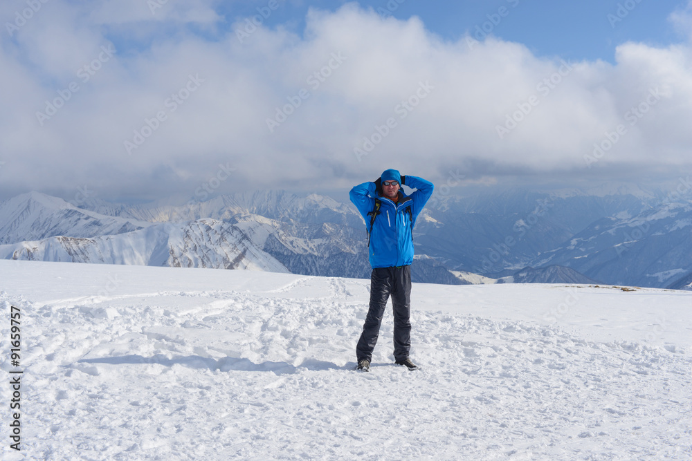 Smiling hiker is enjoying life in the winter mountains. Smiling hiker is enjoying life in the winter mountains.