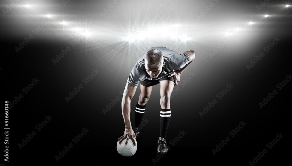 Composite image of rugby player taking position