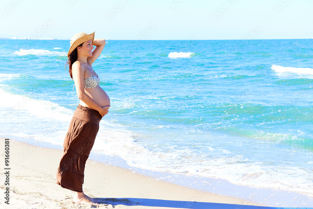 Beautiful pregnant woman on the beach Beautiful pregnant woman on the beach