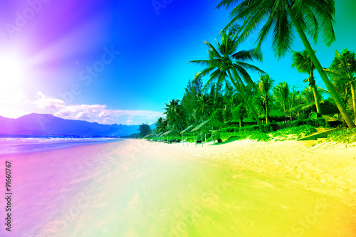 Fototapeta Naklejka Na Ścianę i Meble -  Sunrise colored over jungle island sea
