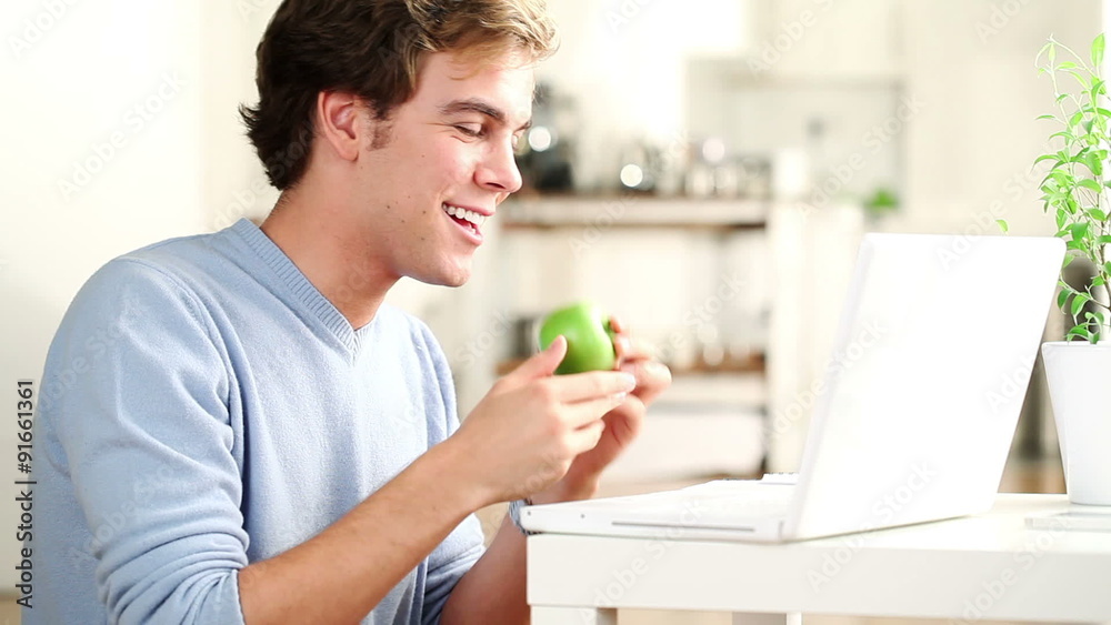 Healthy man eating green apple Healthy man eating green apple