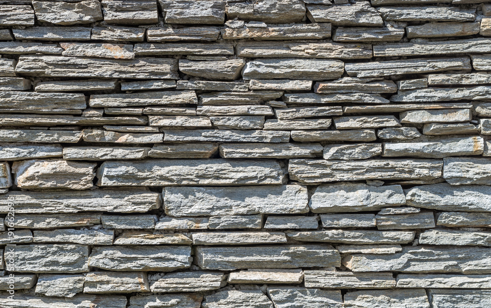 Rough grey stone wall