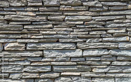 Rough grey stone wall