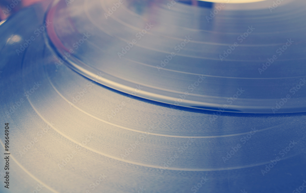 Segment of vinyl record with label showing the texture of the gr Segment of vinyl record with label showing the texture of the gr