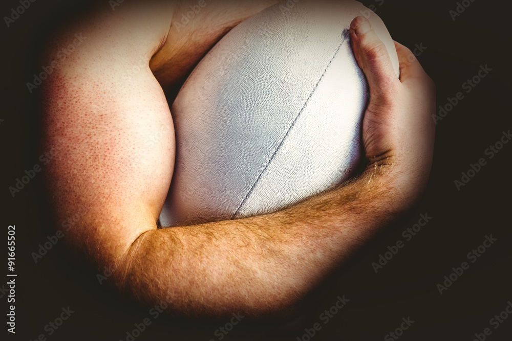 Fototapeta premium Shirtless rugby player holding ball
