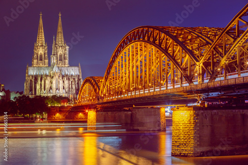 Night View Of Cologne Cathedral And Hohenzollern Bridge, Germany