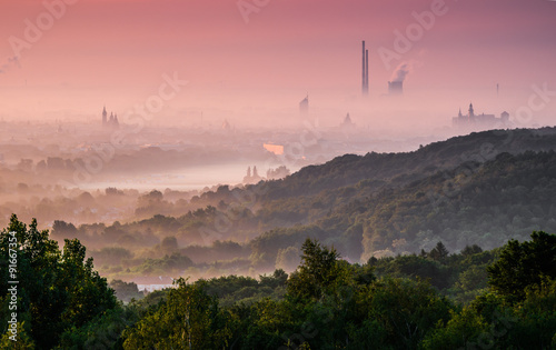 Krakow city in delicate fog seen in the morning from the Pilsudski Mound.