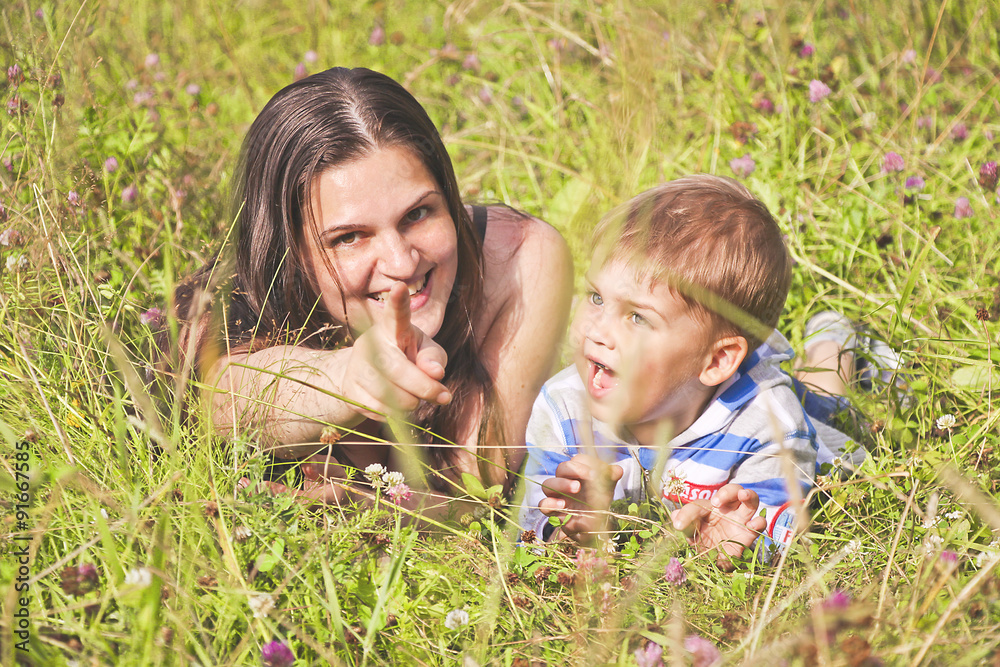 happy mother with child resting outdoors happy mother with child resting outdoors