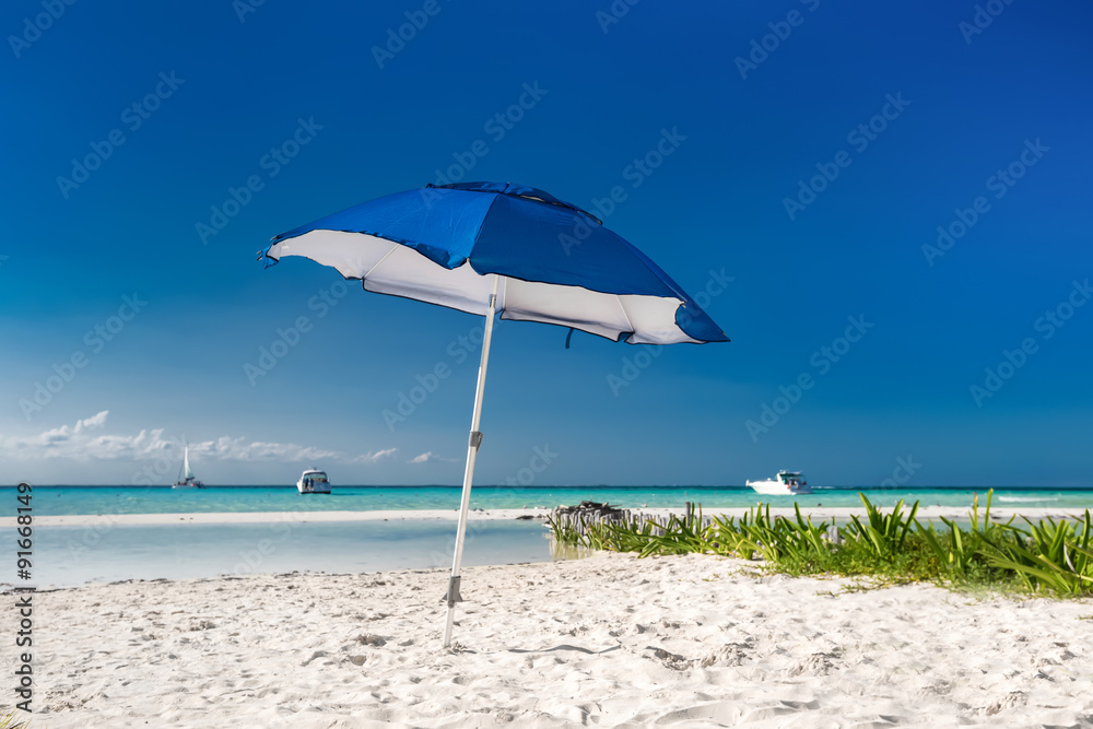 Sun umbrella on caribbean beach