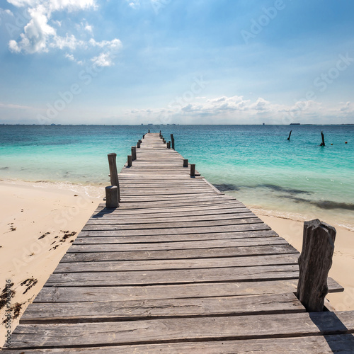 Wooden pier on tropical beach  Cancun