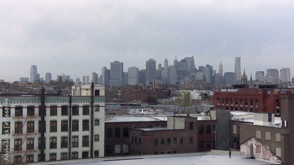 The Manhattan skyline as seen from a rooftop in Brooklyn. The Manhattan skyline as seen from a rooftop in Brooklyn.