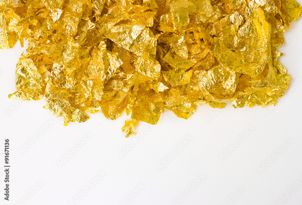 background with scraps of gold foil and empty space background with scraps of gold foil and empty space