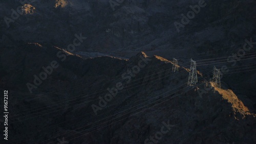 Aerial view of powerlines snaking through the mountains near the Hoover Dam.