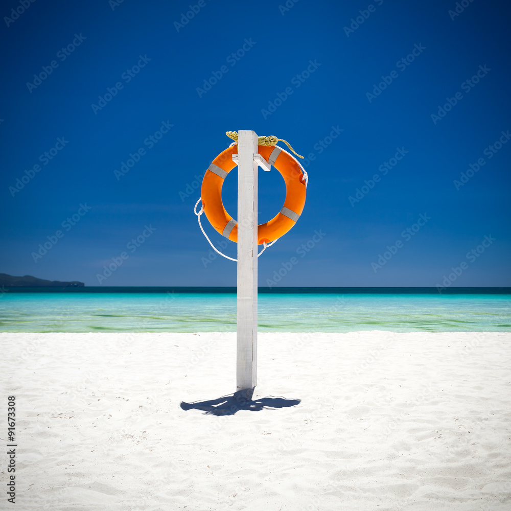 Lifebuoy ring on tropical beach