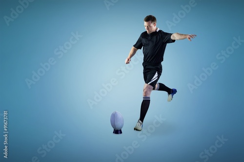 Composite image of rugby player doing a drop kick © vectorfusionart