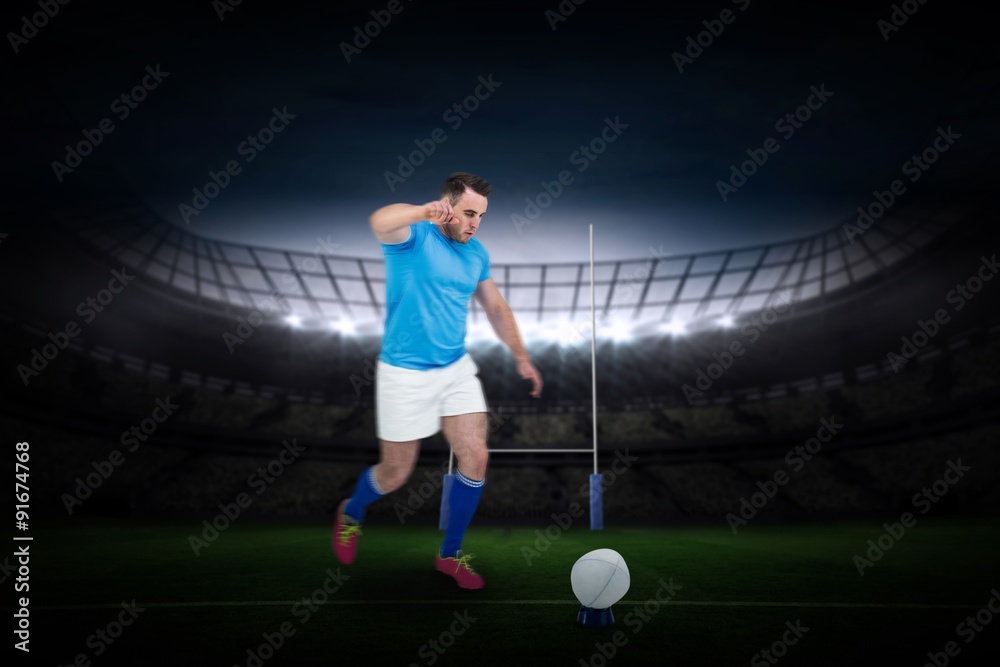 Composite image of rugby player ready to kick Composite image of rugby player ready to kick