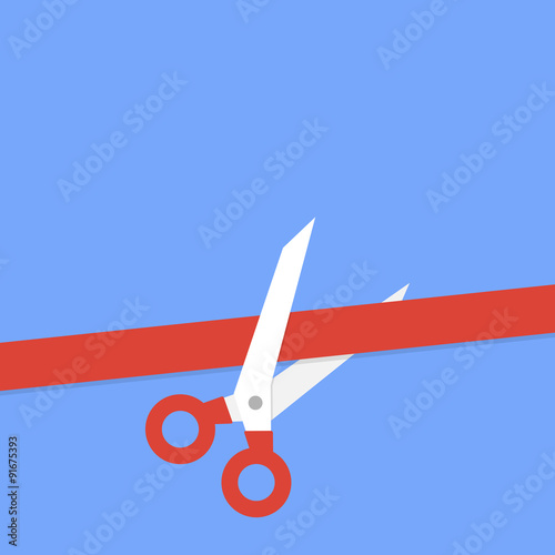 Scissors cutting red ribbon
