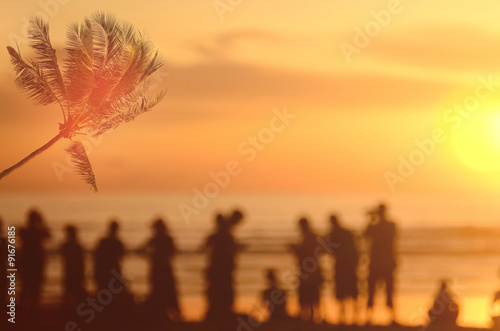 Blur people using smart phone on beach abstract background.