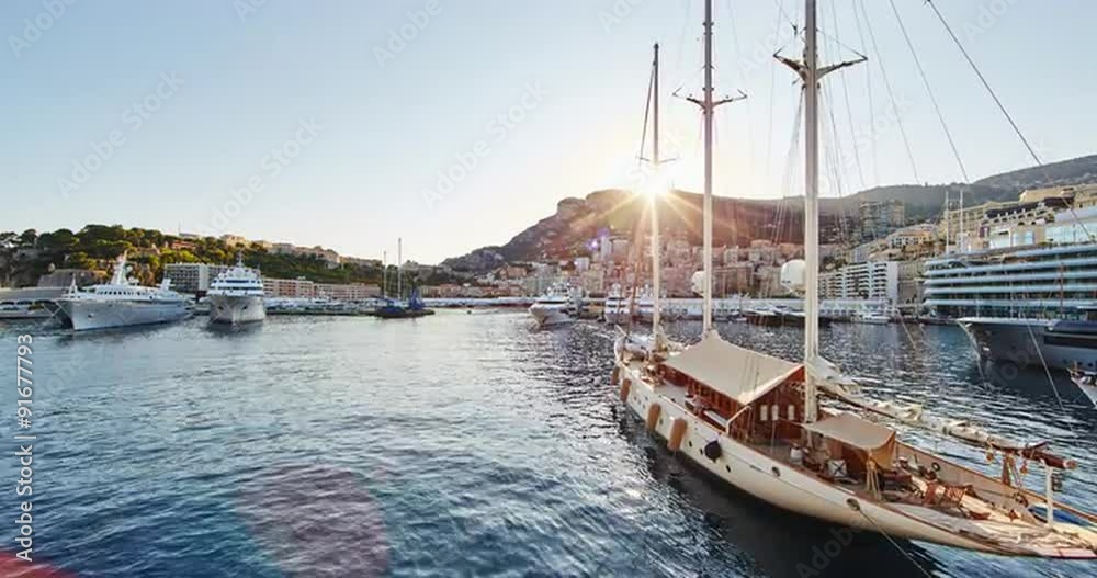 Monaco, Monte-Carlo, 07.09.2015: Port Hercules at sunset, port de Hercule, luxury yachts, big boat, yacht show, mediterranean sea, time-lapse 4k video, motor boat, princes palace of monaco Monaco, Monte-Carlo, 07.09.2015: Port Hercules at sunset, port de Hercule, luxury yachts, big boat, yacht show, mediterranean sea, time-lapse 4k video, motor boat, princes palace of monaco