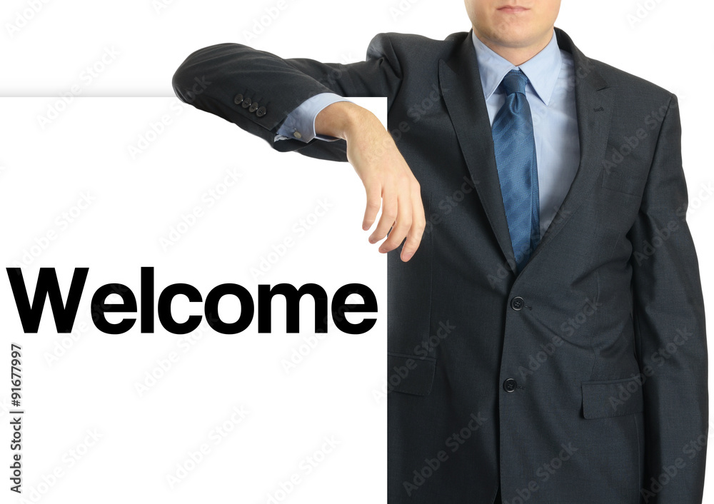 Businessman holding or showing banner with text Welcome Businessman holding or showing banner with text Welcome