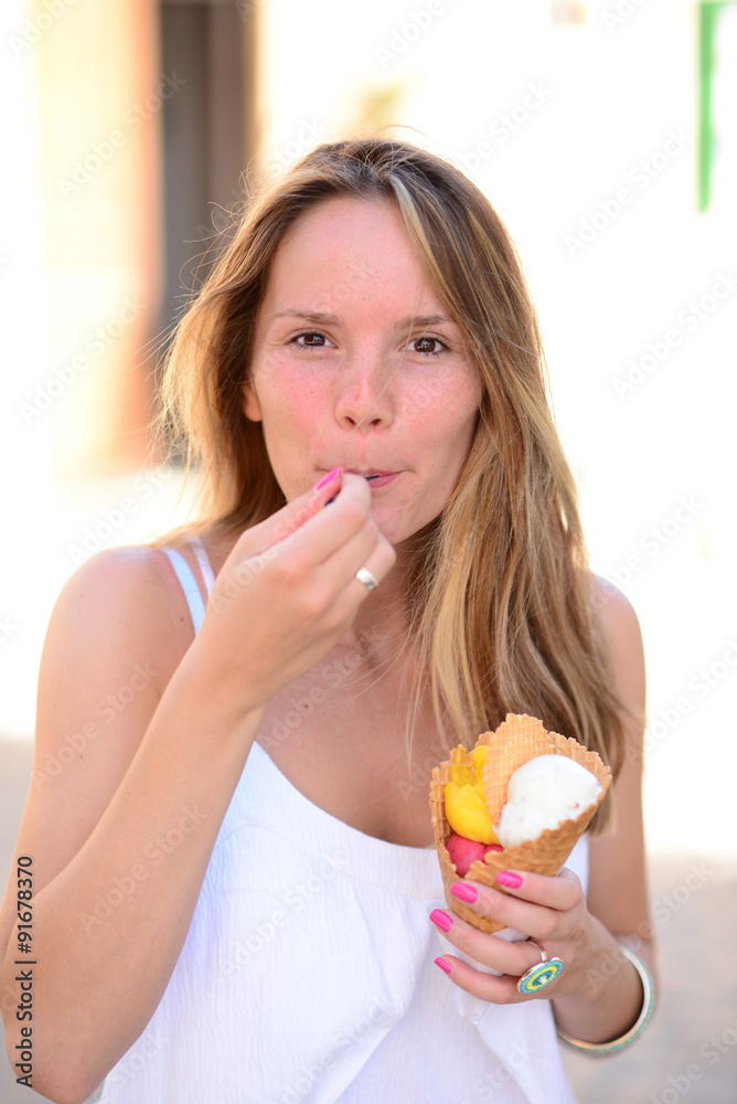 Portrait of young happy woman eating ice-cream outdoor Portrait of young happy woman eating ice-cream outdoor