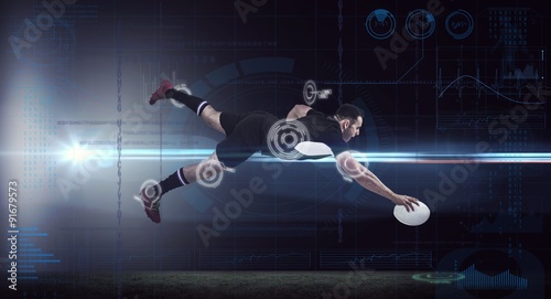 Composite image of rugby player scoring a try © vectorfusionart