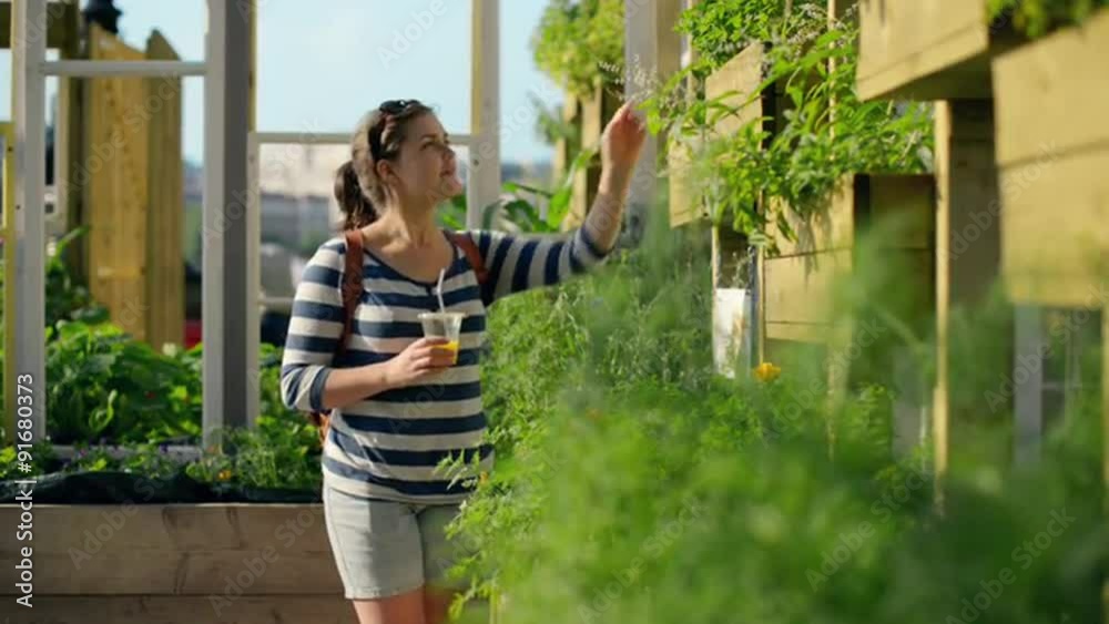 Woman in city farm shopping for plants Woman in city farm shopping for plants