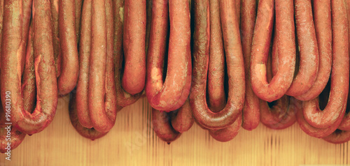 Smoked sausages meat hanging in domestic smokehouse