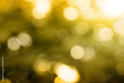 nature bokeh gold background, blurred lights © mckaphoto
