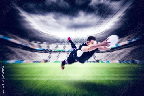 Composite image of rugby player scoring a try © vectorfusionart