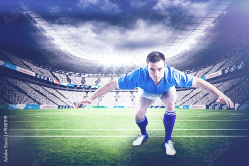 Composite image of rugby player with hands on hips