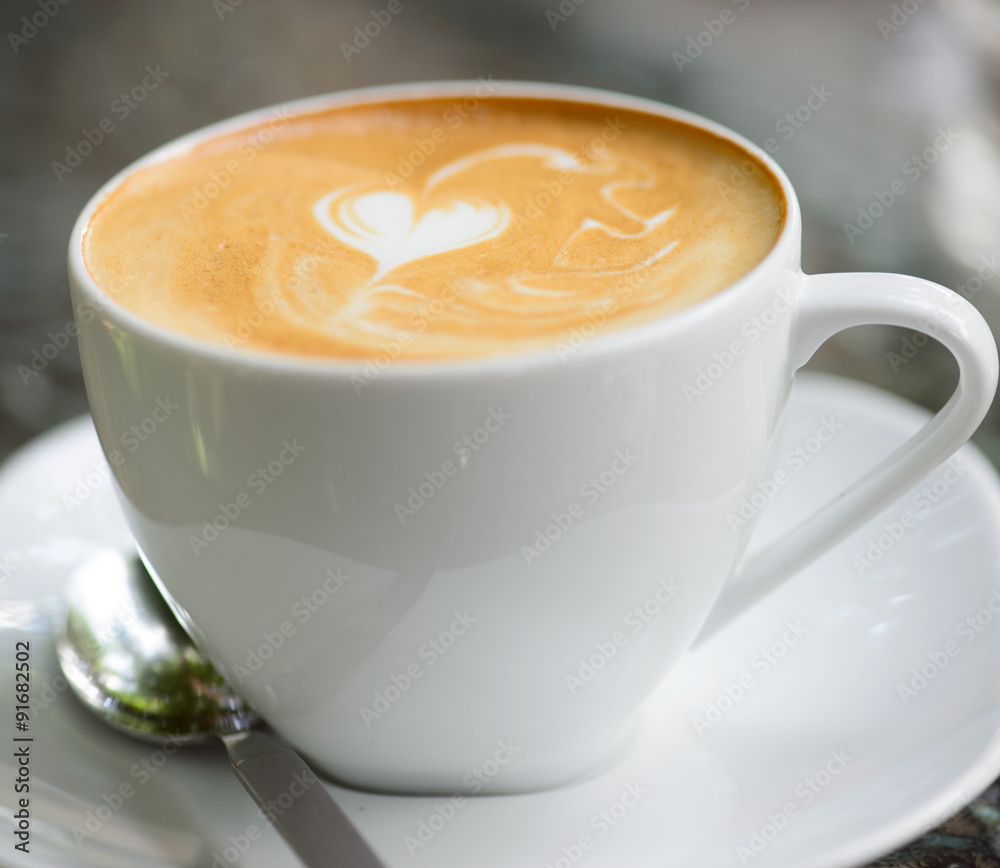 Cappuccino or latte coffee with heart shape Cappuccino or latte coffee with heart shape