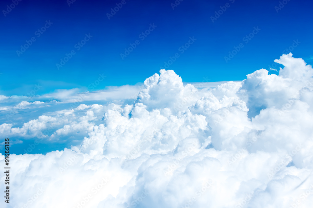 Aerial view of Blue sky and Cloud Top view from airplane window, - obrazy, fototapety, plakaty 