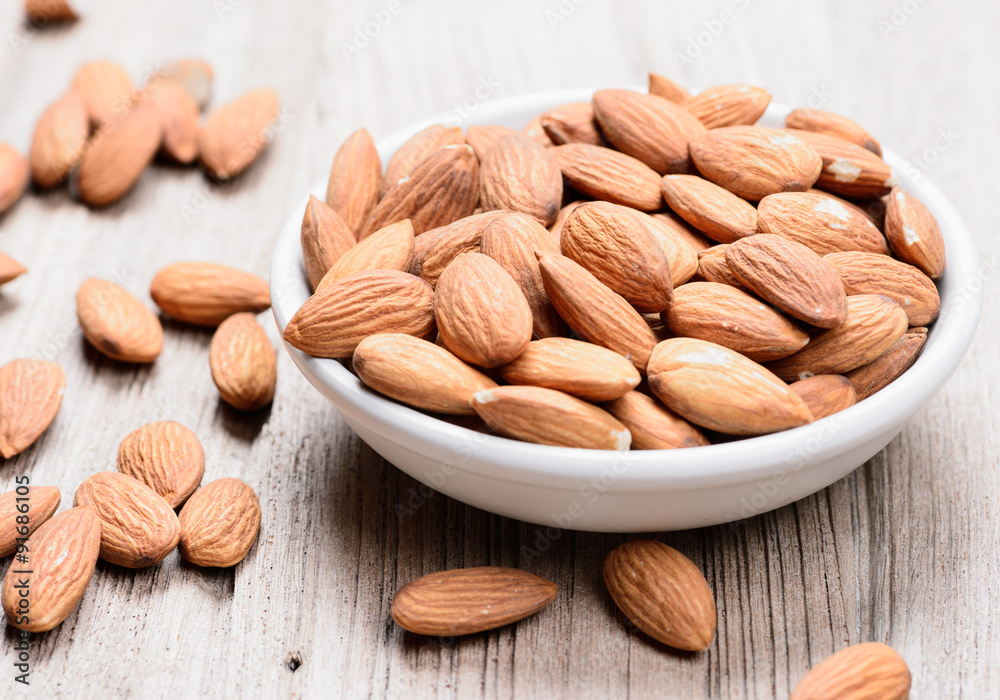 almonds in a ceramic bowl almonds in a ceramic bowl