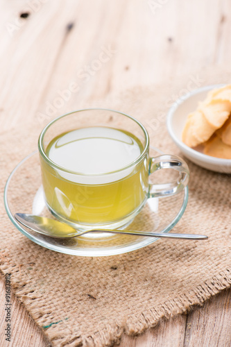 cup of green tea with cookies