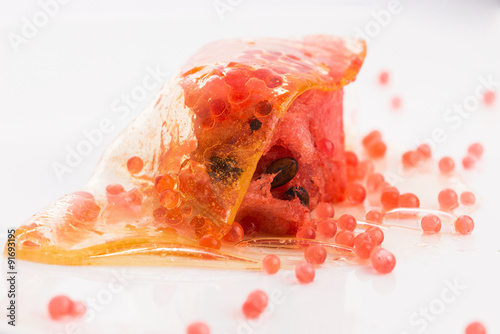 Fototapeta Naklejka Na Ścianę i Meble -  honey wrap with watermelon and strawberry caviar - molecular gas