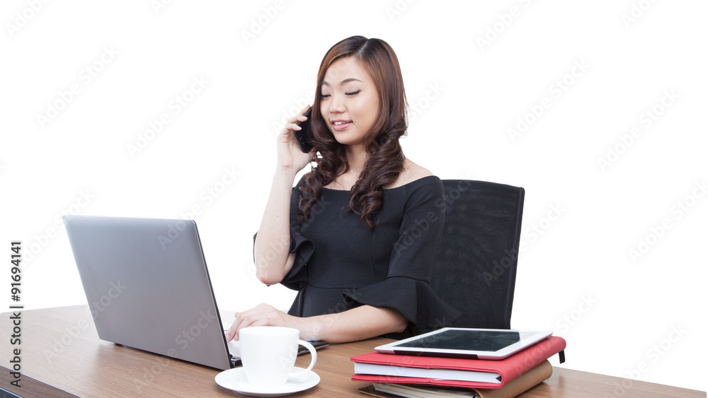 Beautiful smiling businesswoman talking on a cellphone Beautiful smiling businesswoman talking on a cellphone