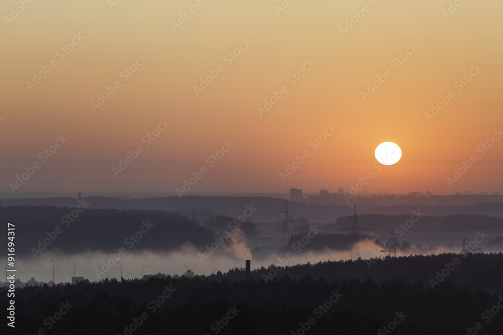 Fototapeta premium Early foggy morning over the city
