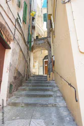 ITALY EMPIRE - JULY 14, 2014: View of the alley with stairs up t © Tseytlin