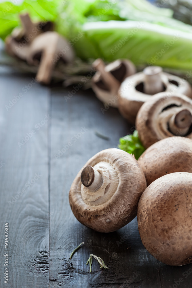 Fresh portobello on wooden background Fresh portobello on wooden background
