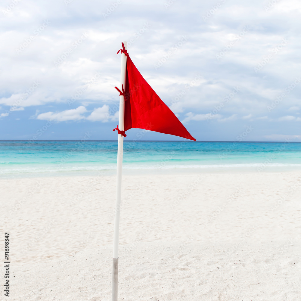 Lifeguard red flag at the beach in bad weather