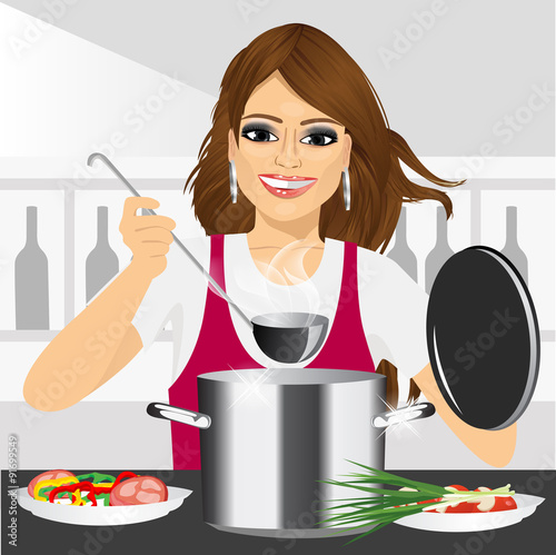 smiling young woman cooking in kitchen