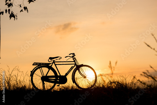 beautiful landscape image with Bicycle at sunset © Looker_Studio