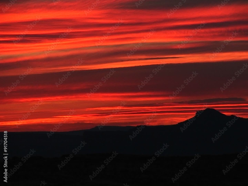 Medium-shot of a brilliant orange sunset over Lake Powell, Arizona Medium-shot of a brilliant orange sunset over Lake Powell, Arizona