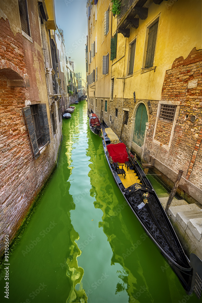 Typical alley of Venice with gondolas