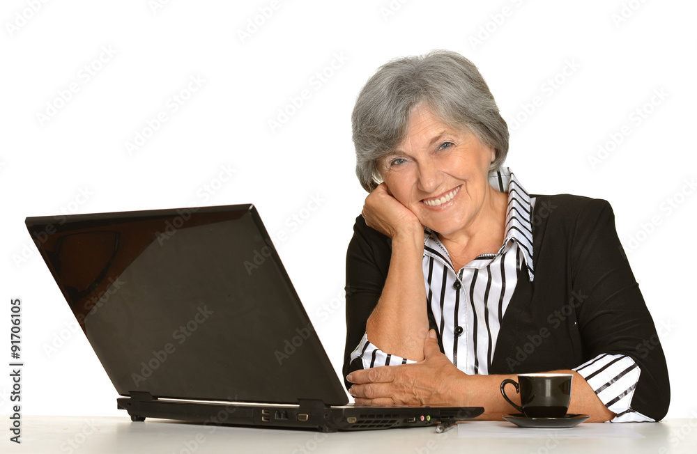 Elderly woman working on laptop Elderly woman working on laptop